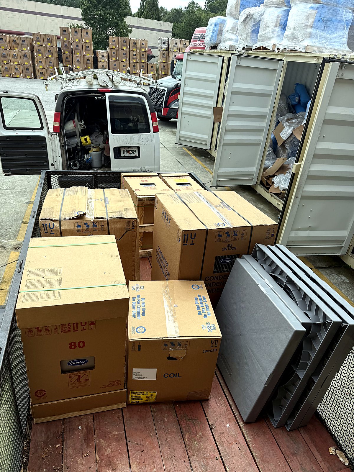 Truck loaded with boxed HVAC equipment on install day