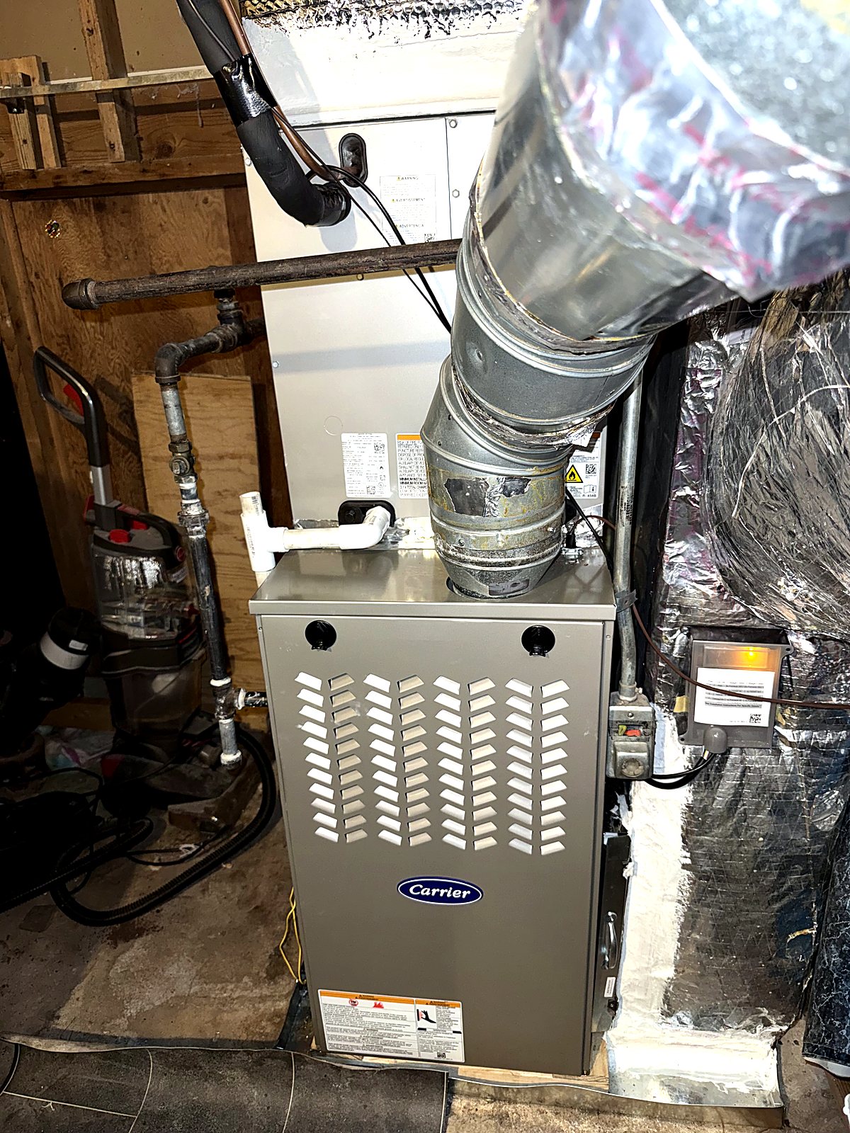 High-efficiency Carrier furnace installed in a basement