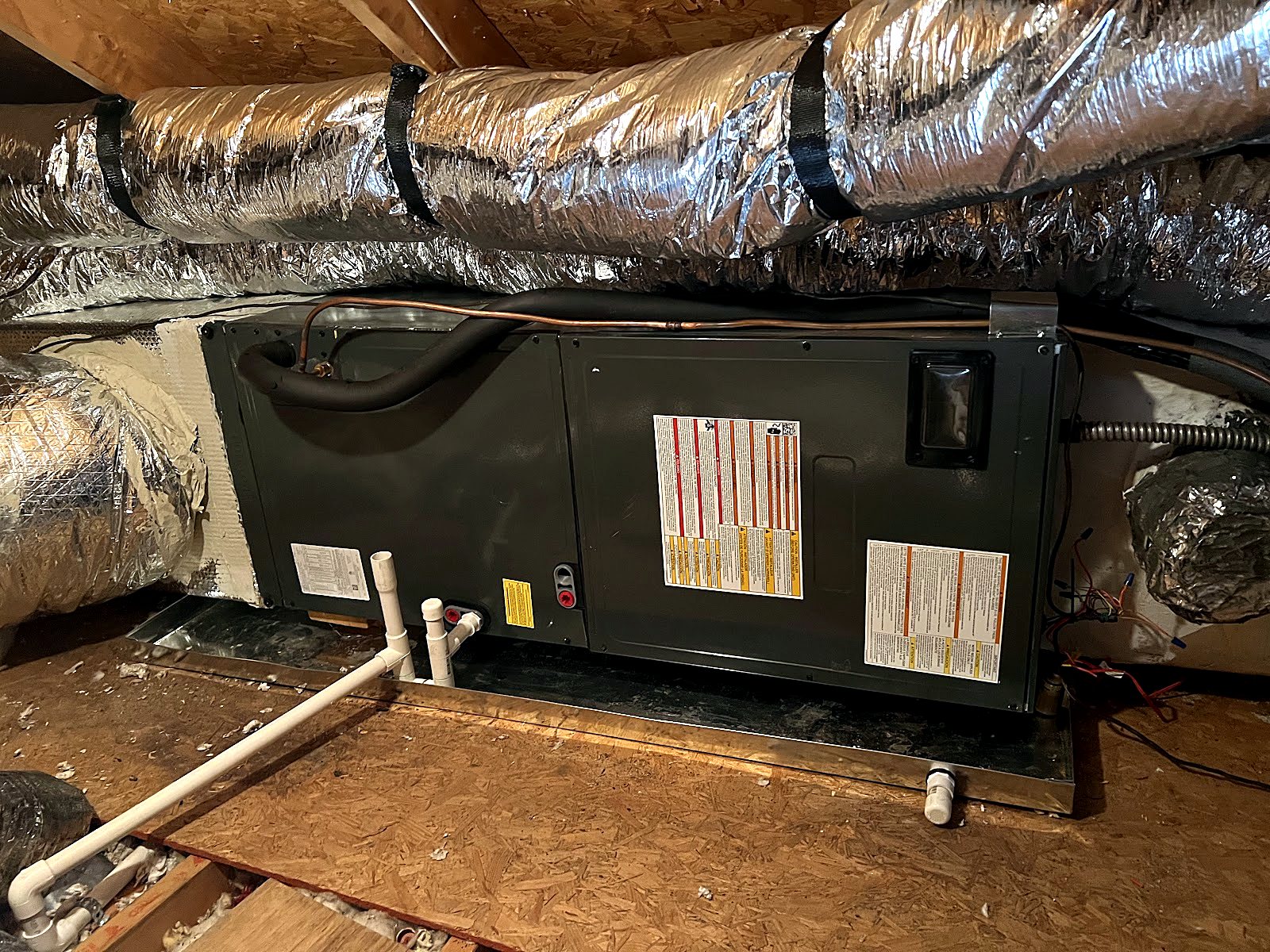 Air handler installed in an insulated attic