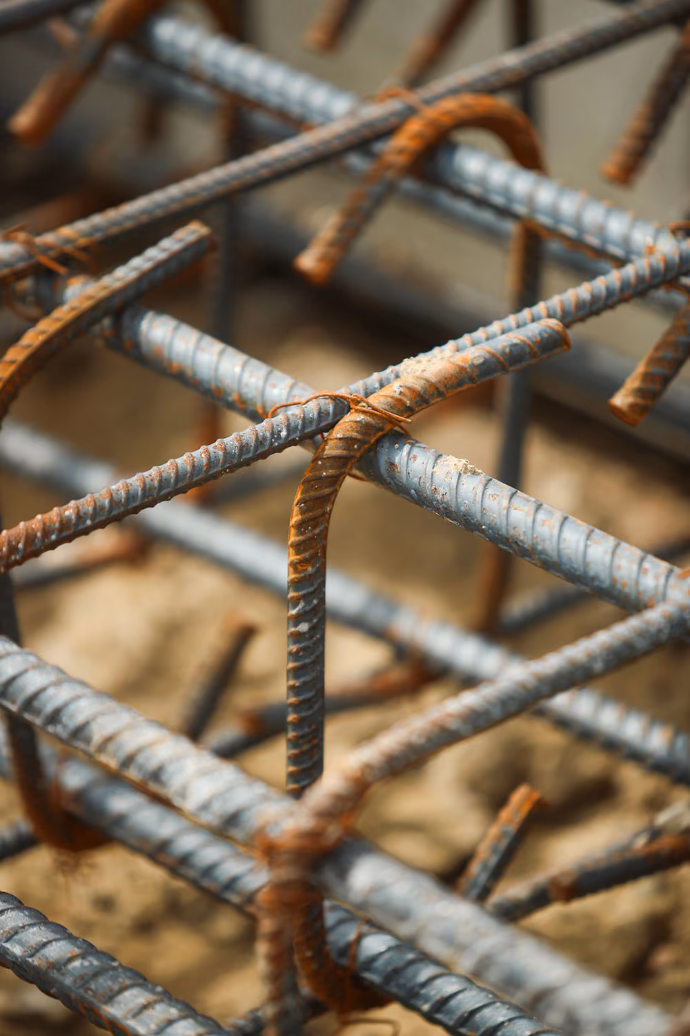Close-up of steel rebar tied with wire for concrete reinforcement in construction.