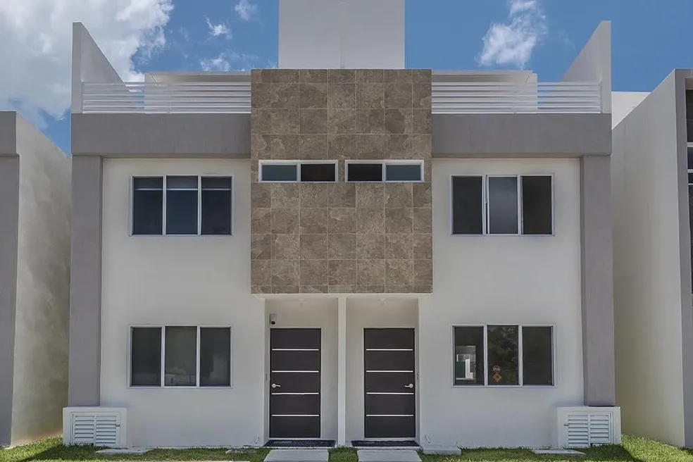 Three-story facade of Casa Ceiba, a private house in a gated community 20 minutes from Cancún airport