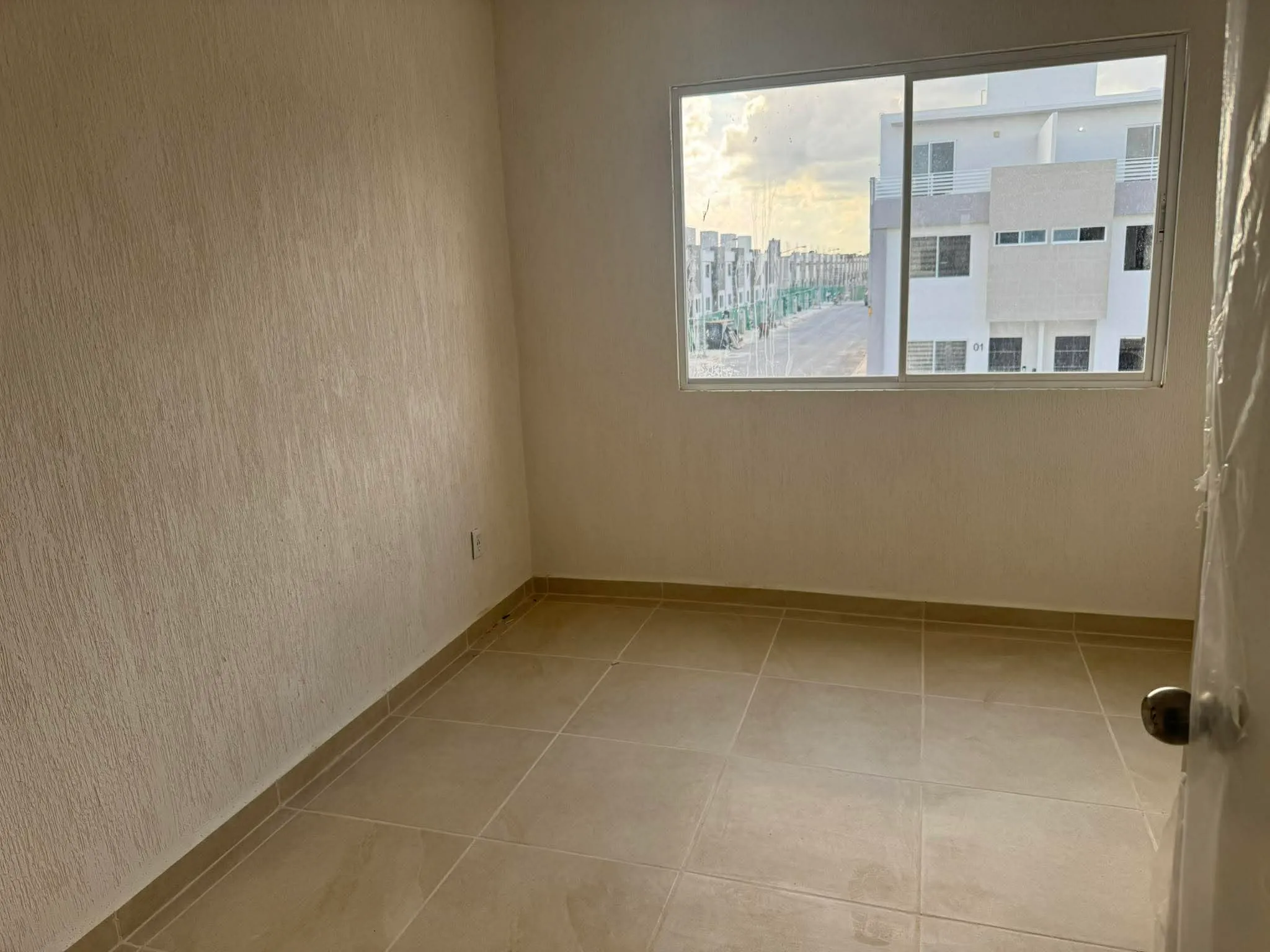 Second bedroom at Casa Ceiba, facing a quiet residential street