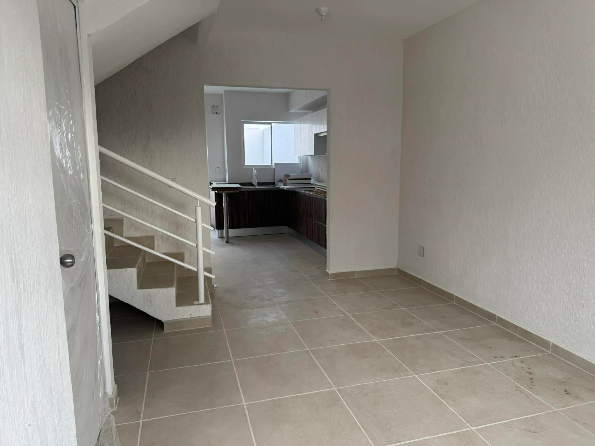 Open-plan living room at Casa Ceiba with seating for a full airline crew