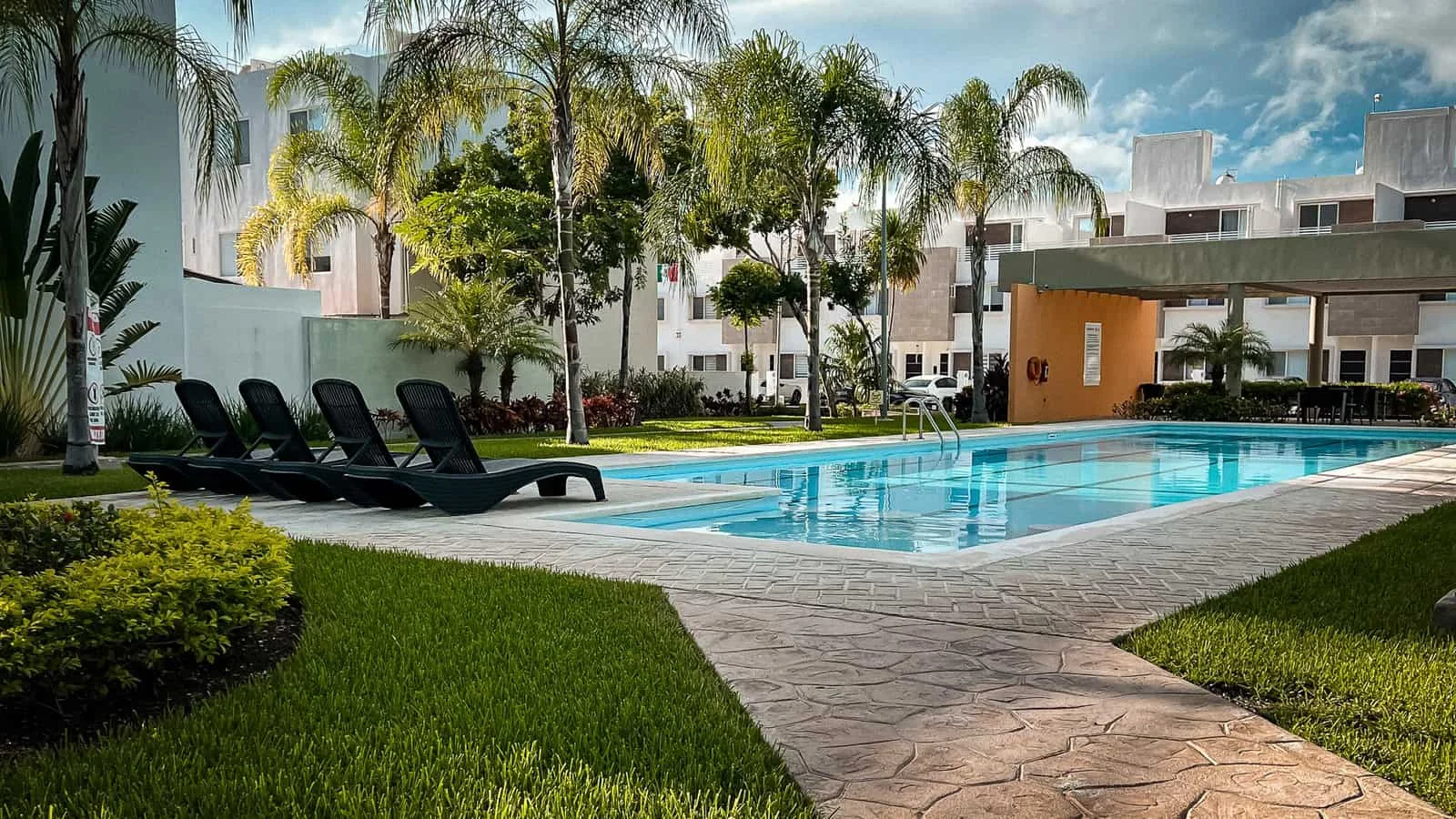 Resort-style community pool at Jardines del Sur 6, steps from Casa Ceiba