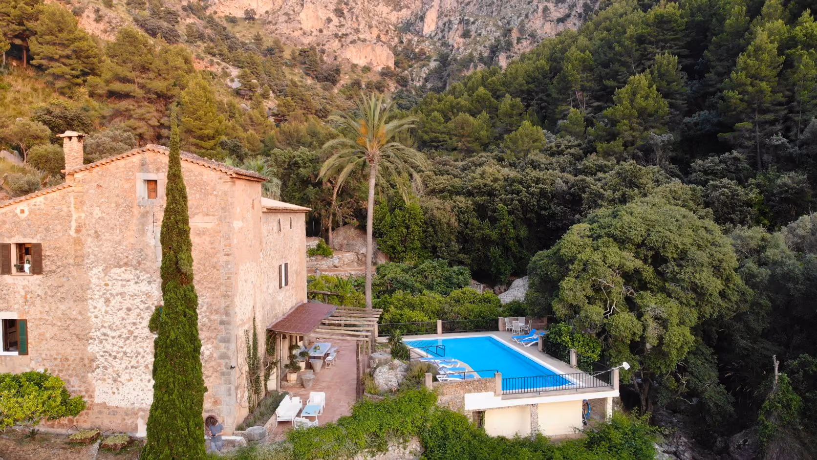The pool terrace at Finca Higo overlooking the Mallorcan coastline