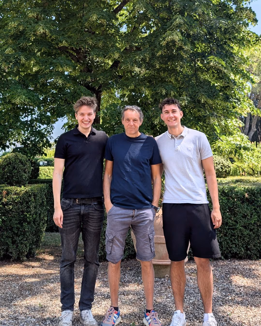The founder of Higo Houses with Jacopo, the concierge of Castello Higo, in the middle, smiling