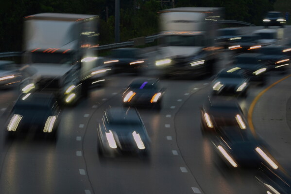 Vehicles drive along a highway July 30, 2025, in Cincinnati. (AP Photo/Joshua A. Bickel, File)
