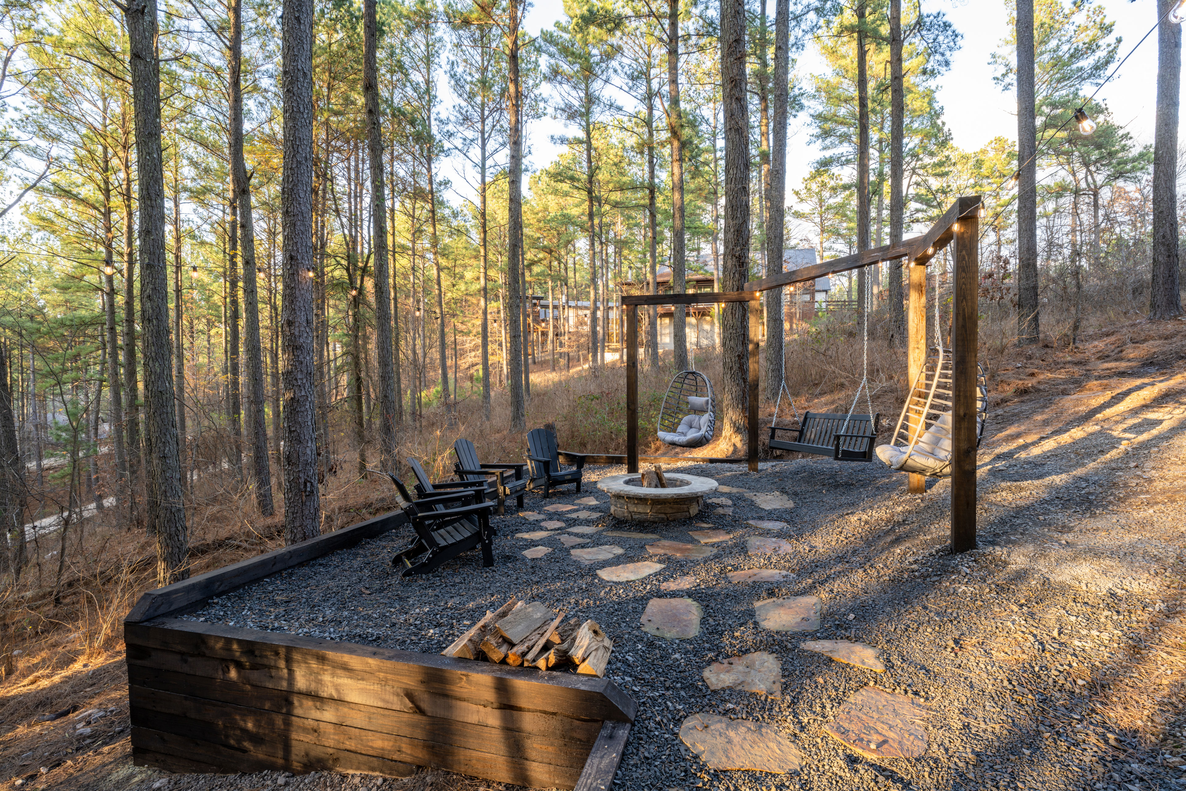 We provide enough firewood for one or two fires. You'll love the seating area with the hanging egg chairs and sturdy bench swing. We also provide Adirondack chairs for additional seating.