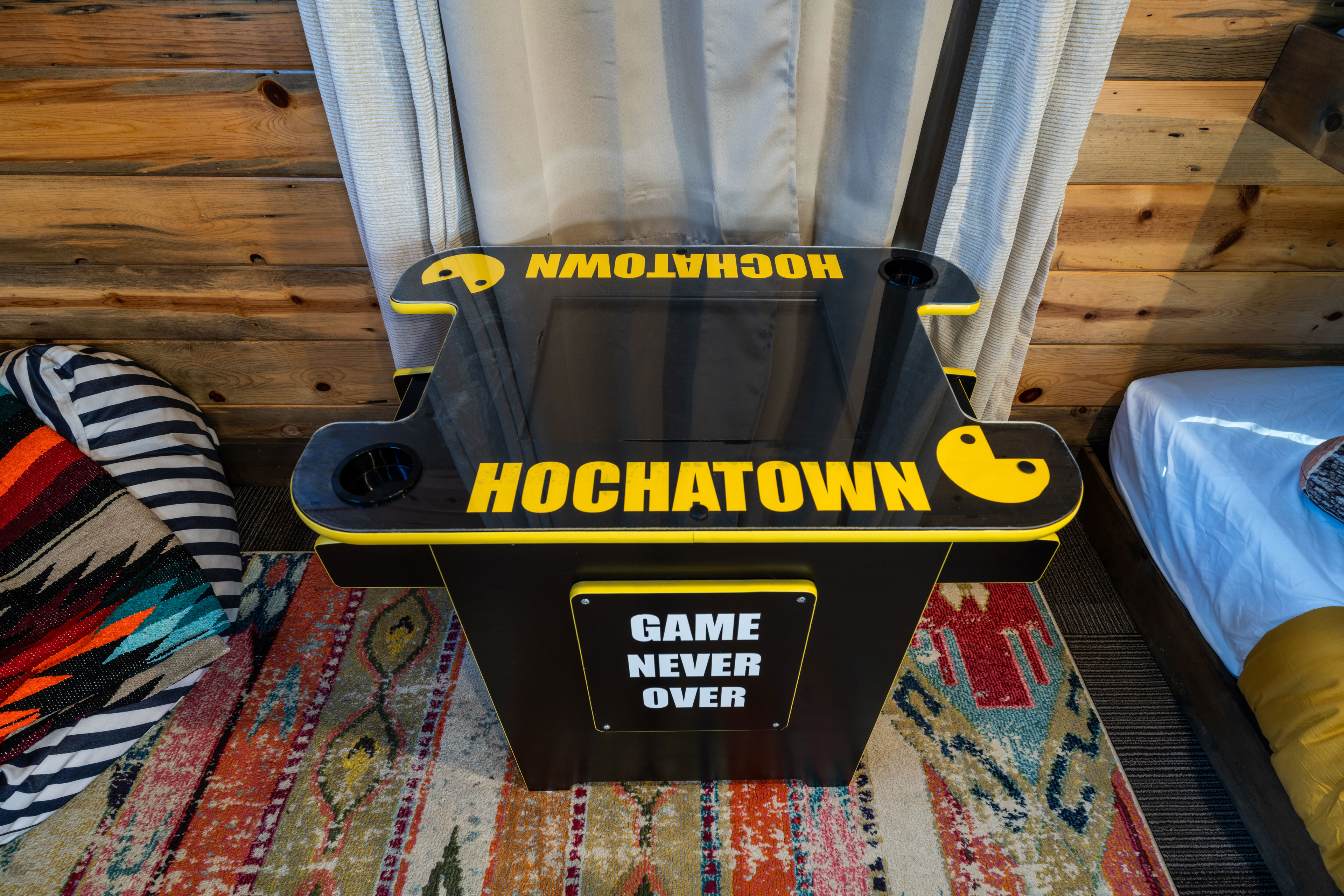 Tap into your favorite 8-bit games on this arcade game located in the loft
