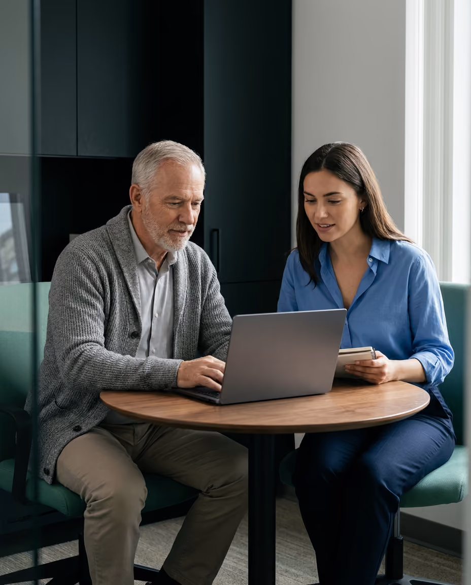 An advisor meeting with two clients