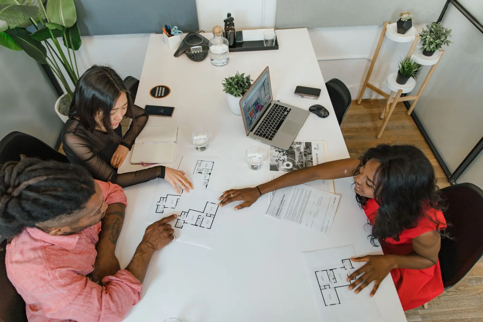 Security consultants reviewing plans with a client