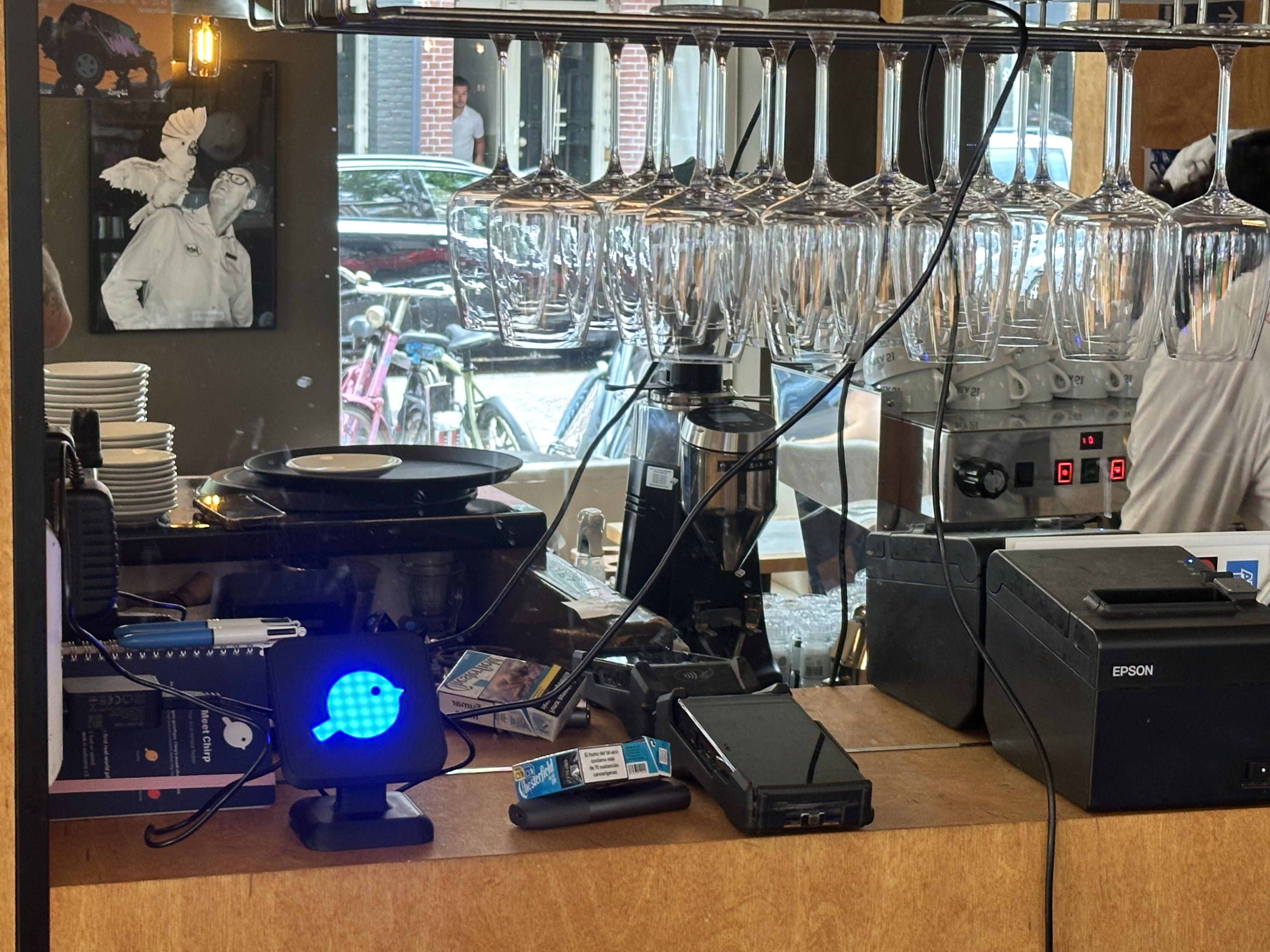 Chirp beside the register behind the bar