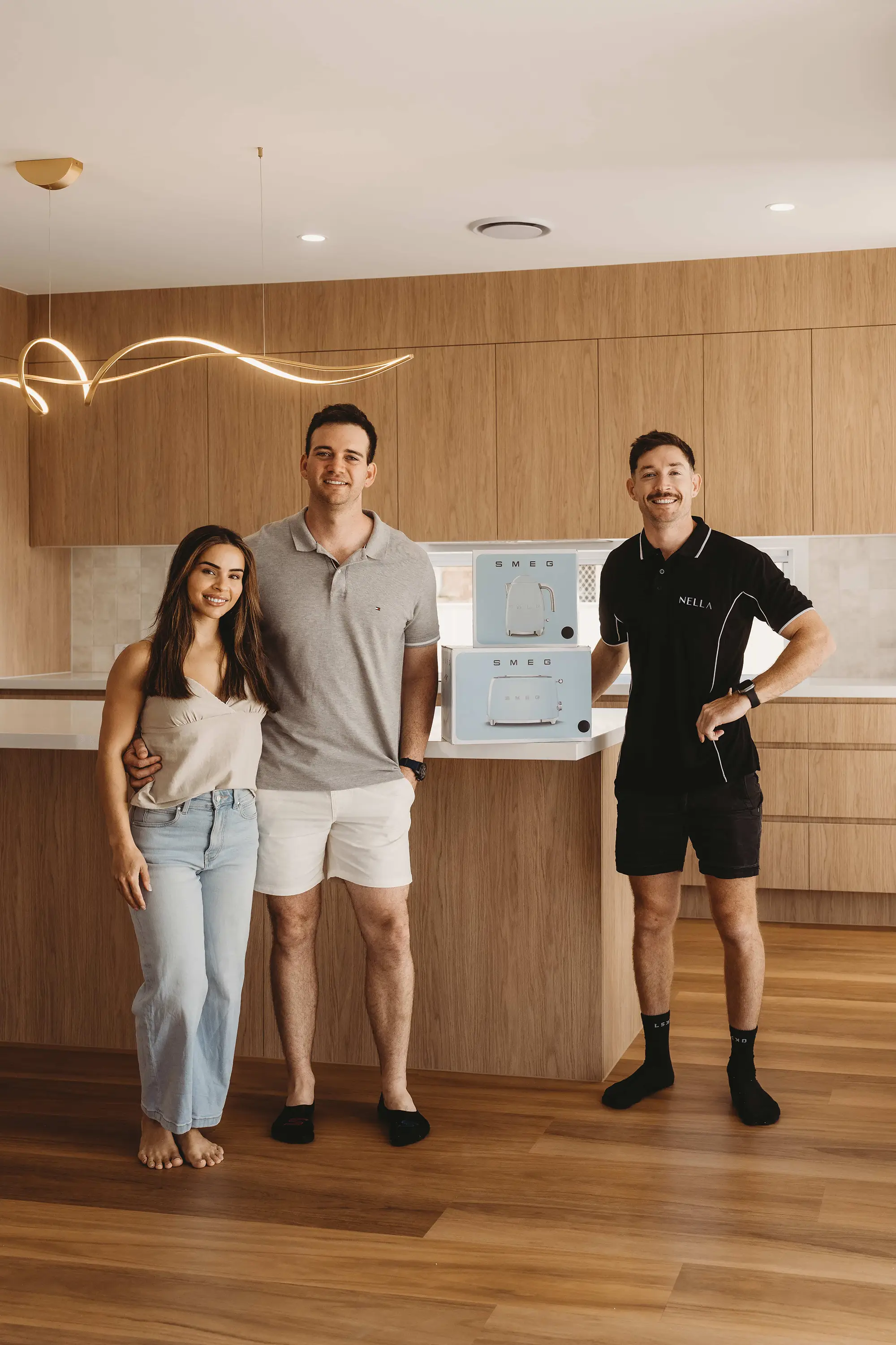 Trent Allen with clients at handover inside a completed Nella home.