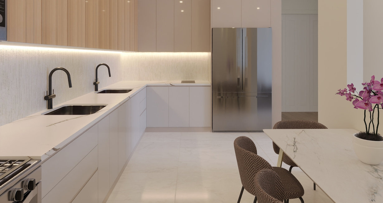 Modern kitchen with white cabinets, two black sinks, stainless steel fridge, and marble dining table with chairs.