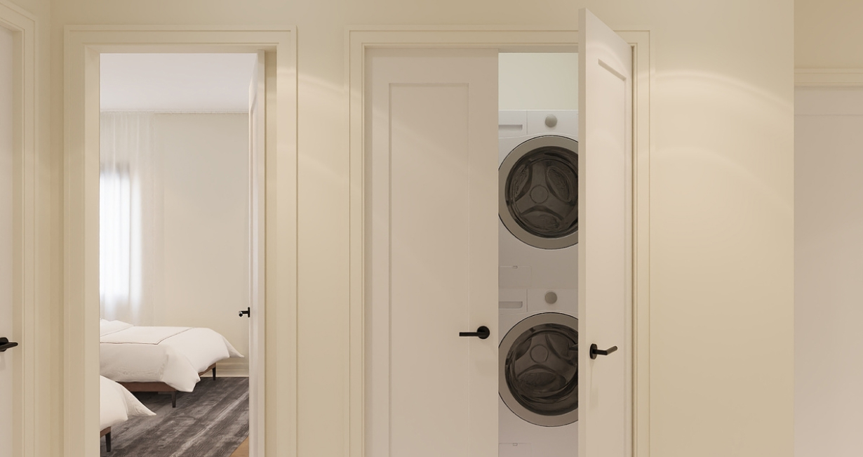 Hallway with white doors, one open showing stacked washer and dryer, another showing a bedroom.