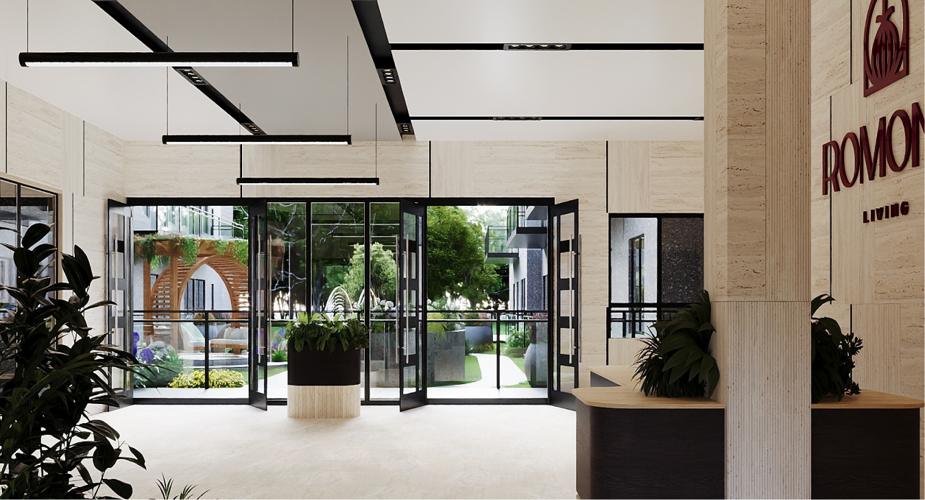 Modern lobby with large glass doors opening to a garden with greenery and wooden archway.