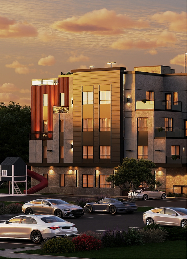 Modern apartment building at sunset with parked cars and a small playground with a slide.