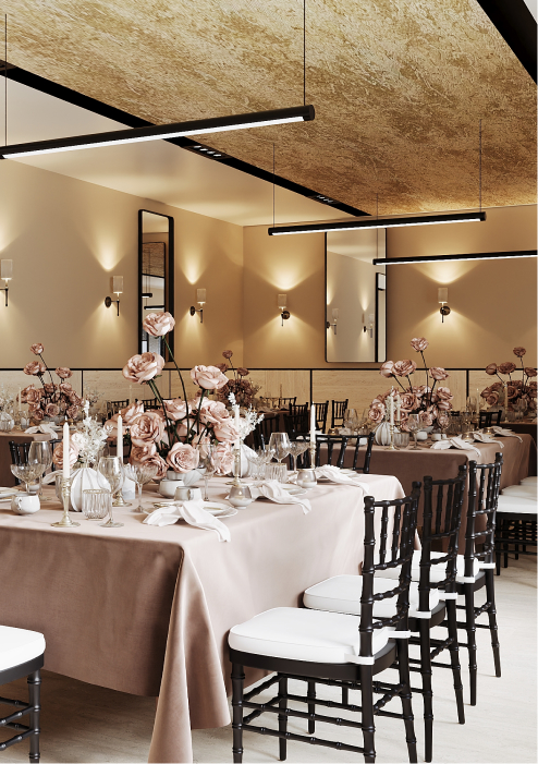 Elegant dining setup with brown tablecloths, floral centerpieces, candles, and black chairs with white cushions.