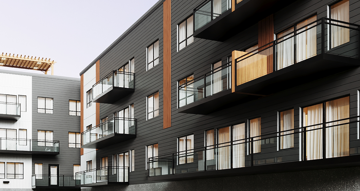 Modern apartment building with dark siding, glass balconies, and large windows with curtains.