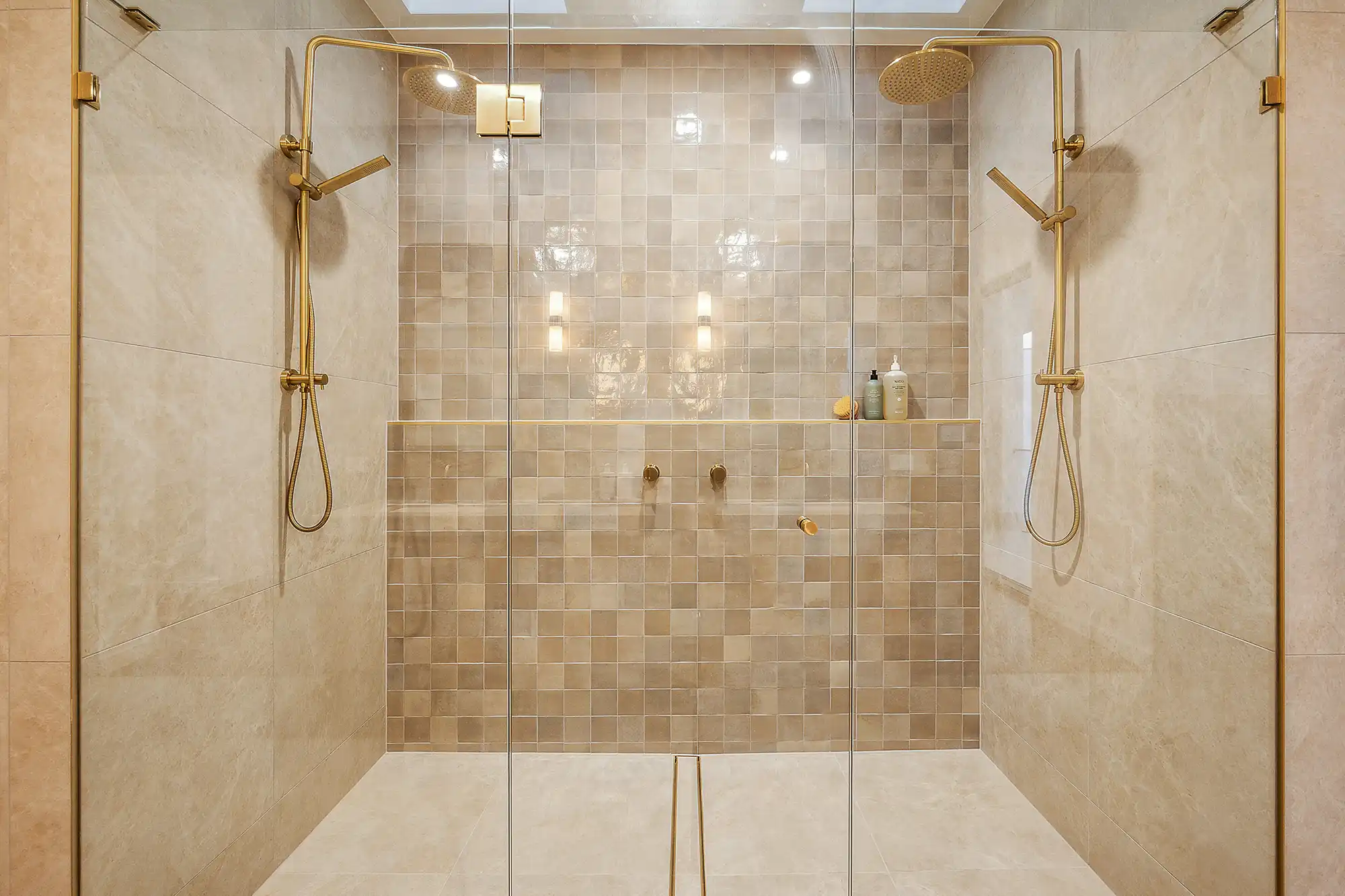 Double shower with brass fixtures inside Marisol by Nella
