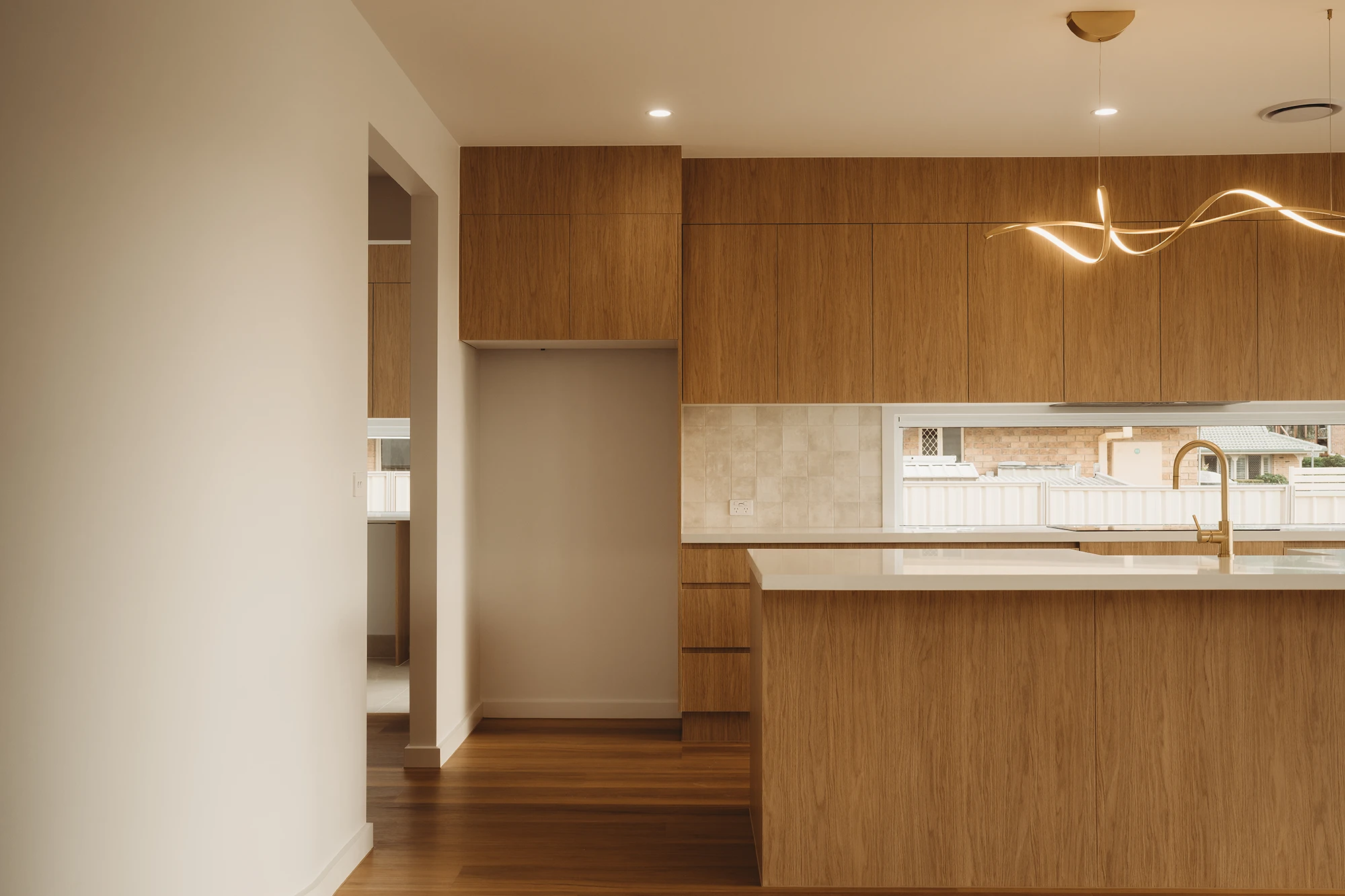 Timber kitchen cabinetry inside Eden by Nella in Banksia Beach