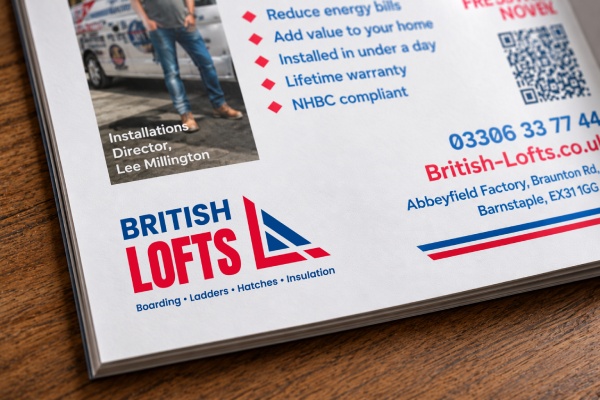 Advertising flyer corner showing the British Lofts logo in blue and red with text listing services: boarding, ladders, hatches, insulation, and a small photo of the Installations Director Lee Millington.