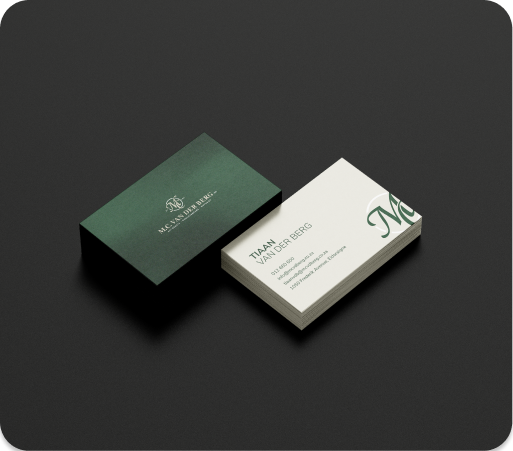 Colorful business cards with MADIMBO and GENE LIKHANYA logos scattered with a silver pen on light blue surface.