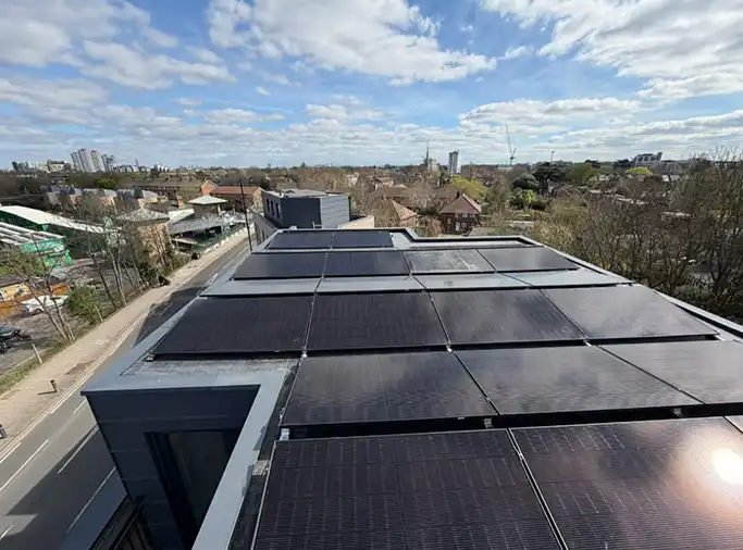 Aerial view of a commercial rooftop fitted with 50 photovoltaic solar panels installed by GES Group.