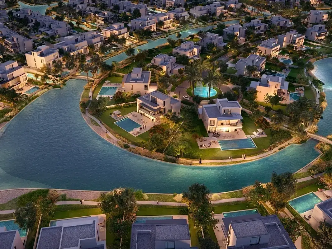 Winding turquoise canal encircling an exclusive enclave of luxury estate villas
