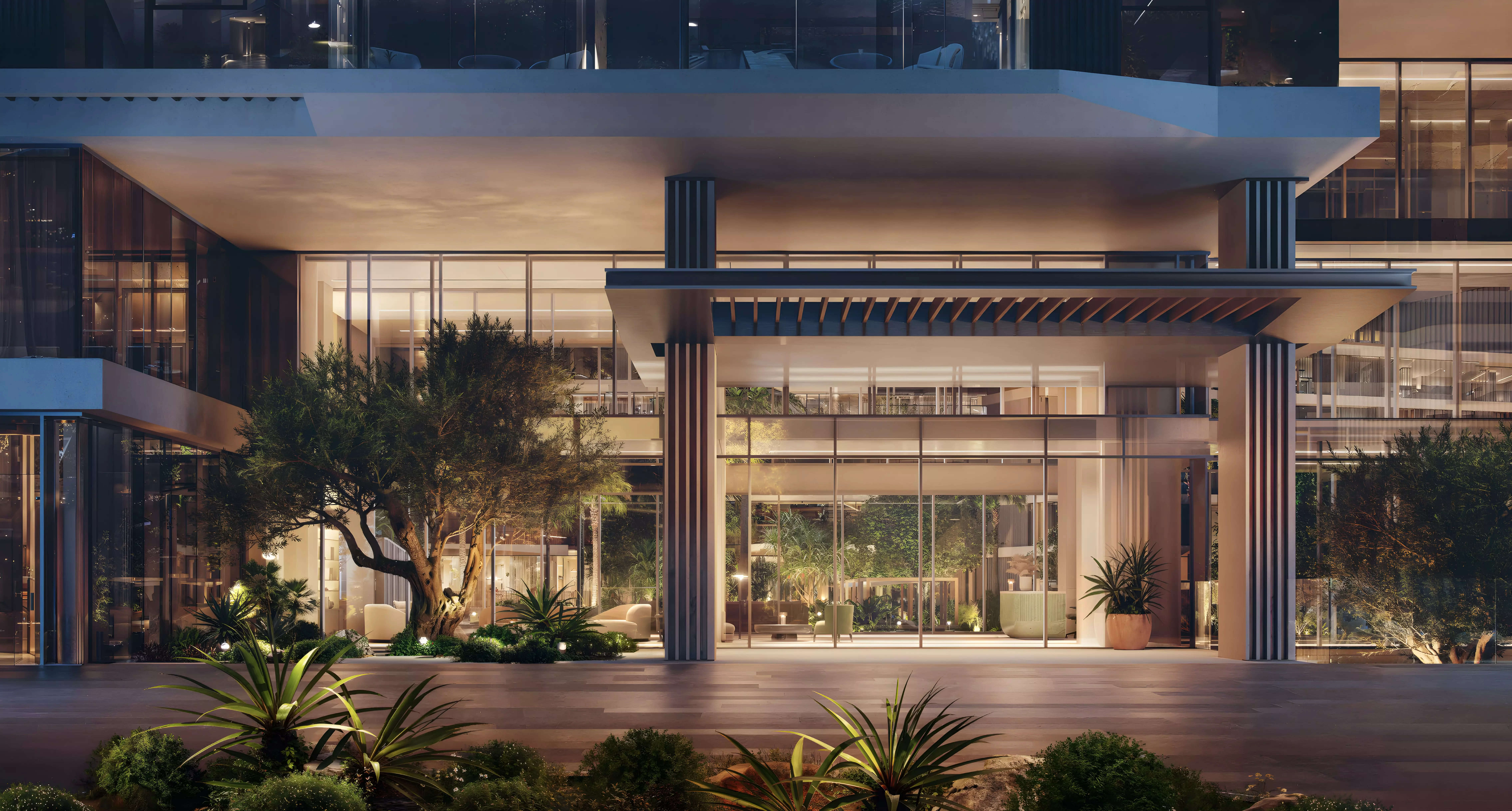 Grand covered entrance lobby and porte-cochère drop-off area of a luxury residential building