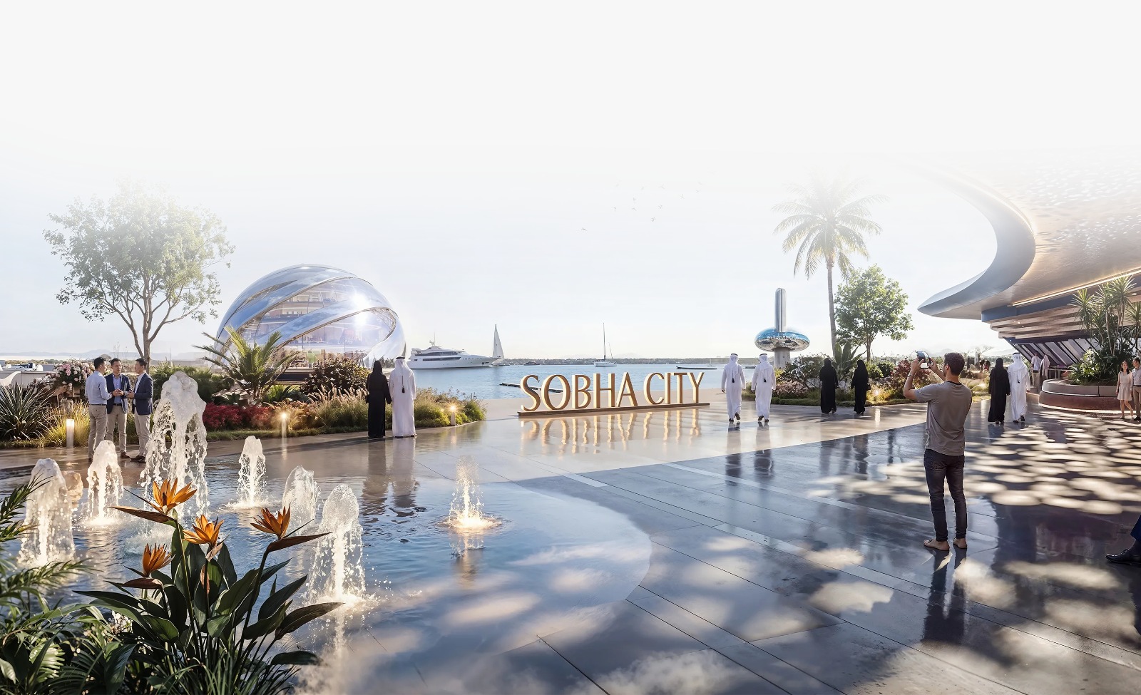 Modern outdoor plaza with water fountain features and domed architecture at a luxury real estate development