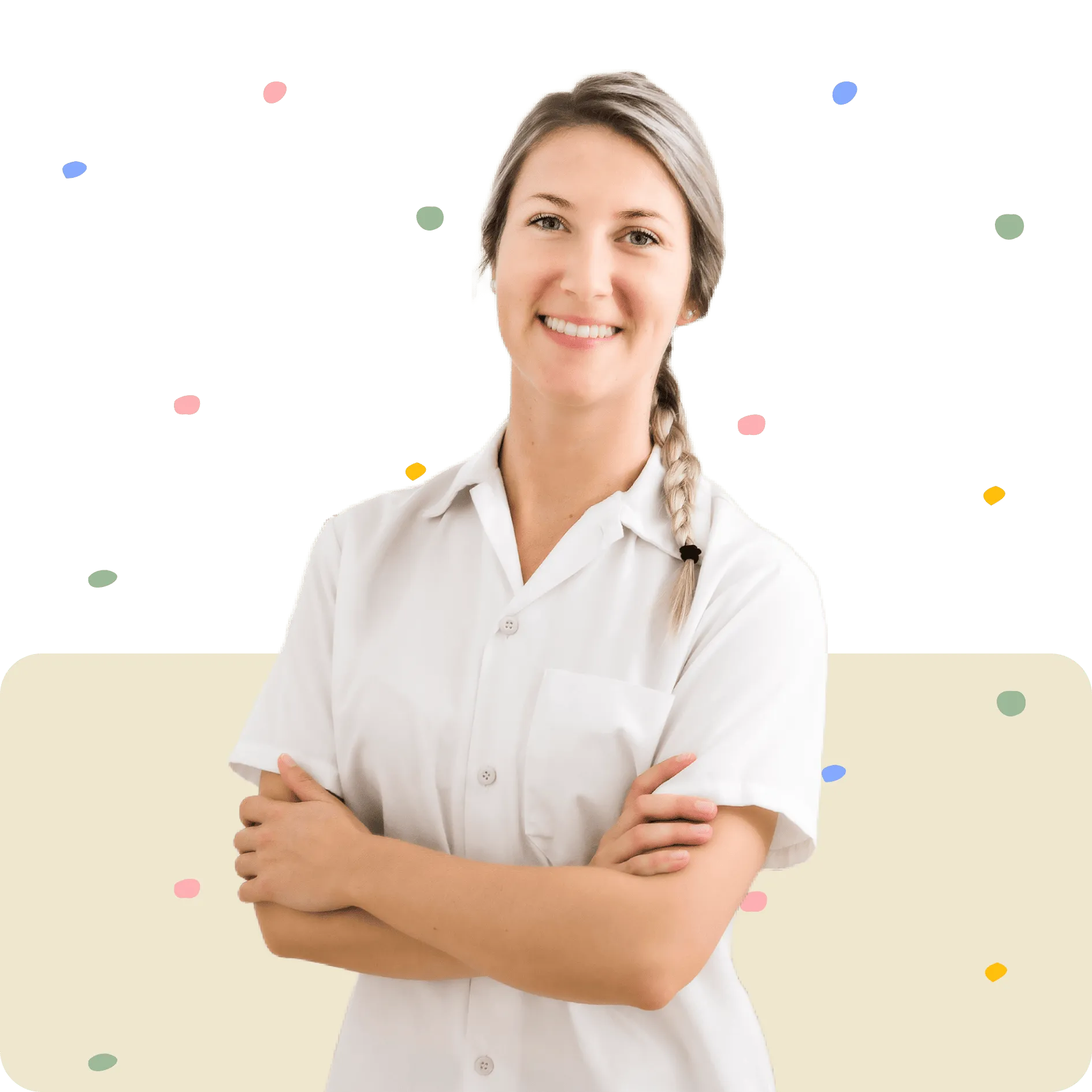 Smiling woman with braided hair in white uniform standing with arms crossed on confetti background.