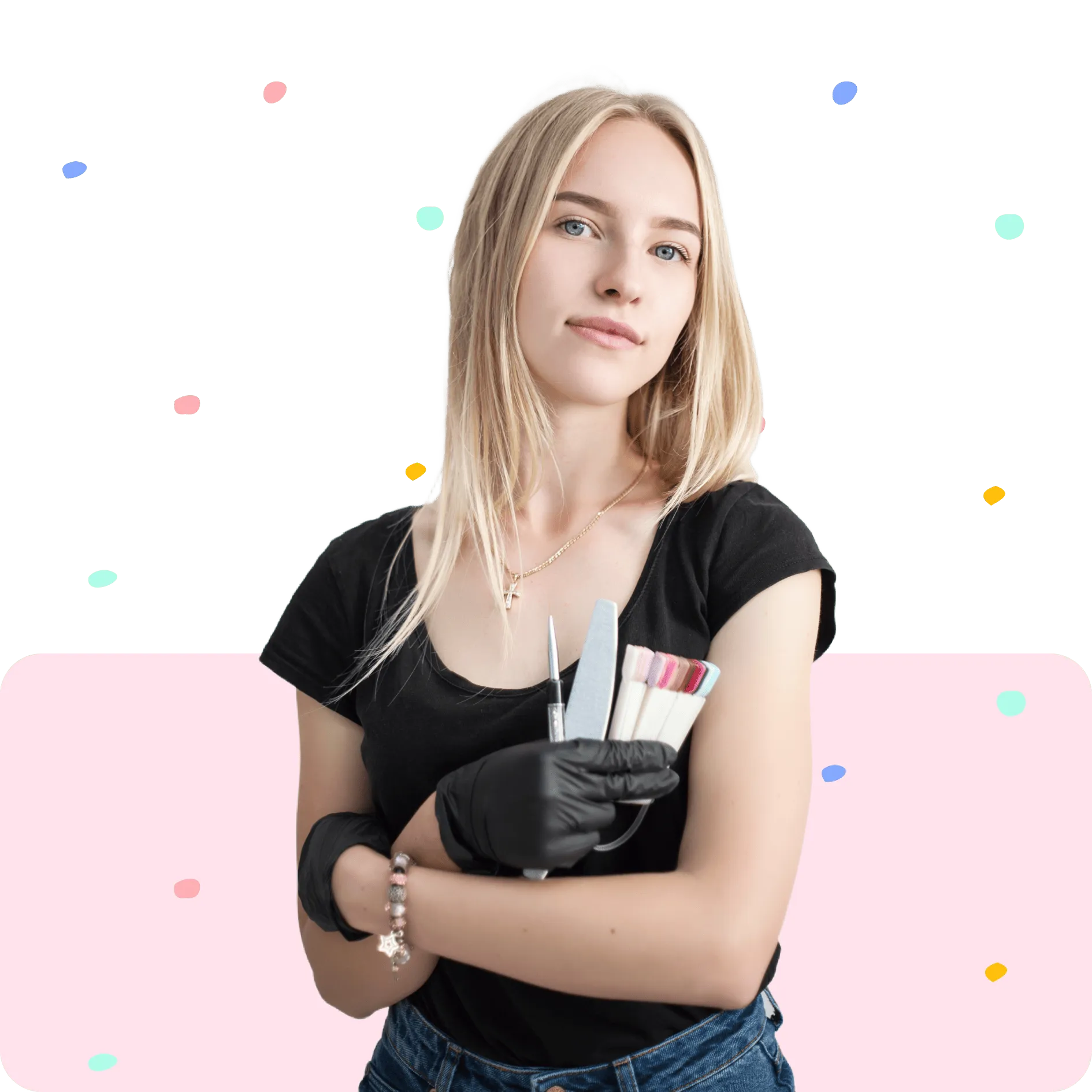 Nail artist with blonde hair wearing black gloves holding nail files and polish swatches.
