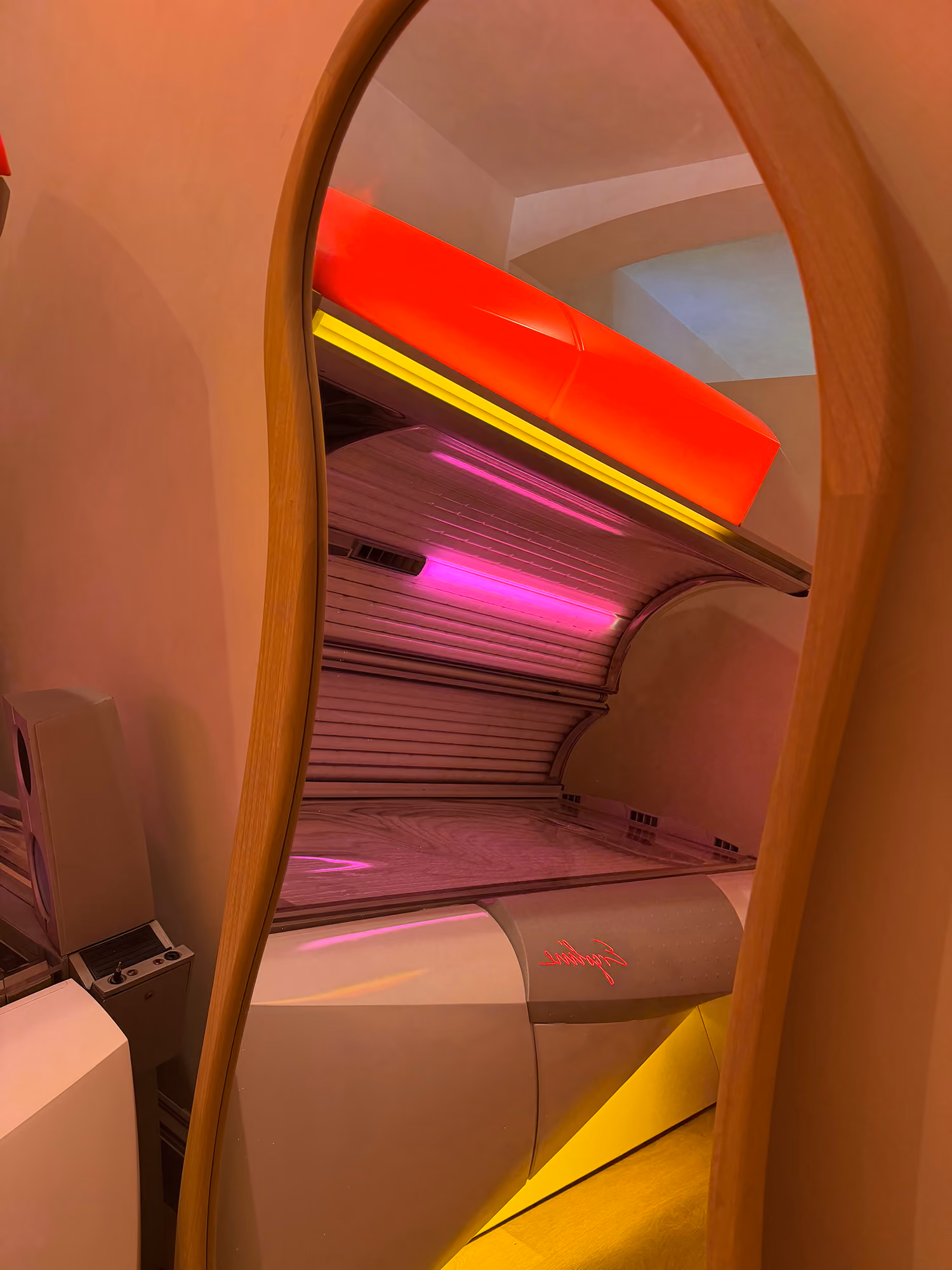 A wider shot of our Ergoline sunbed in a mirror