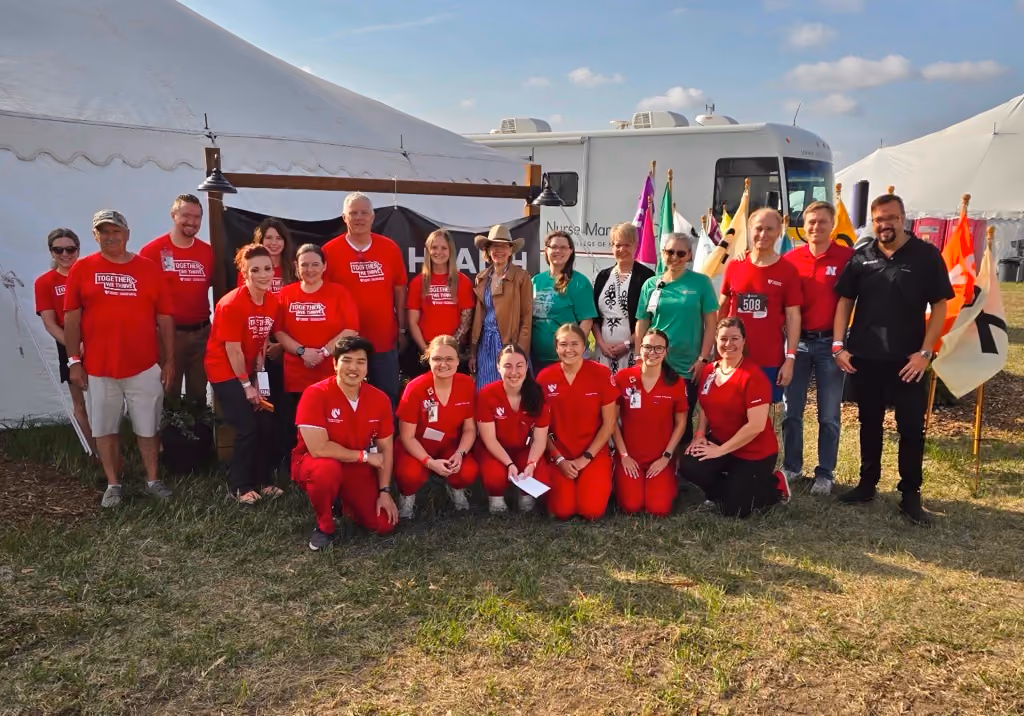 Greg, Head of Clinical Development at Eyenuk, posing with UNMC clinical staff members at the 2026 Cattlemen’s Ball health screening event.