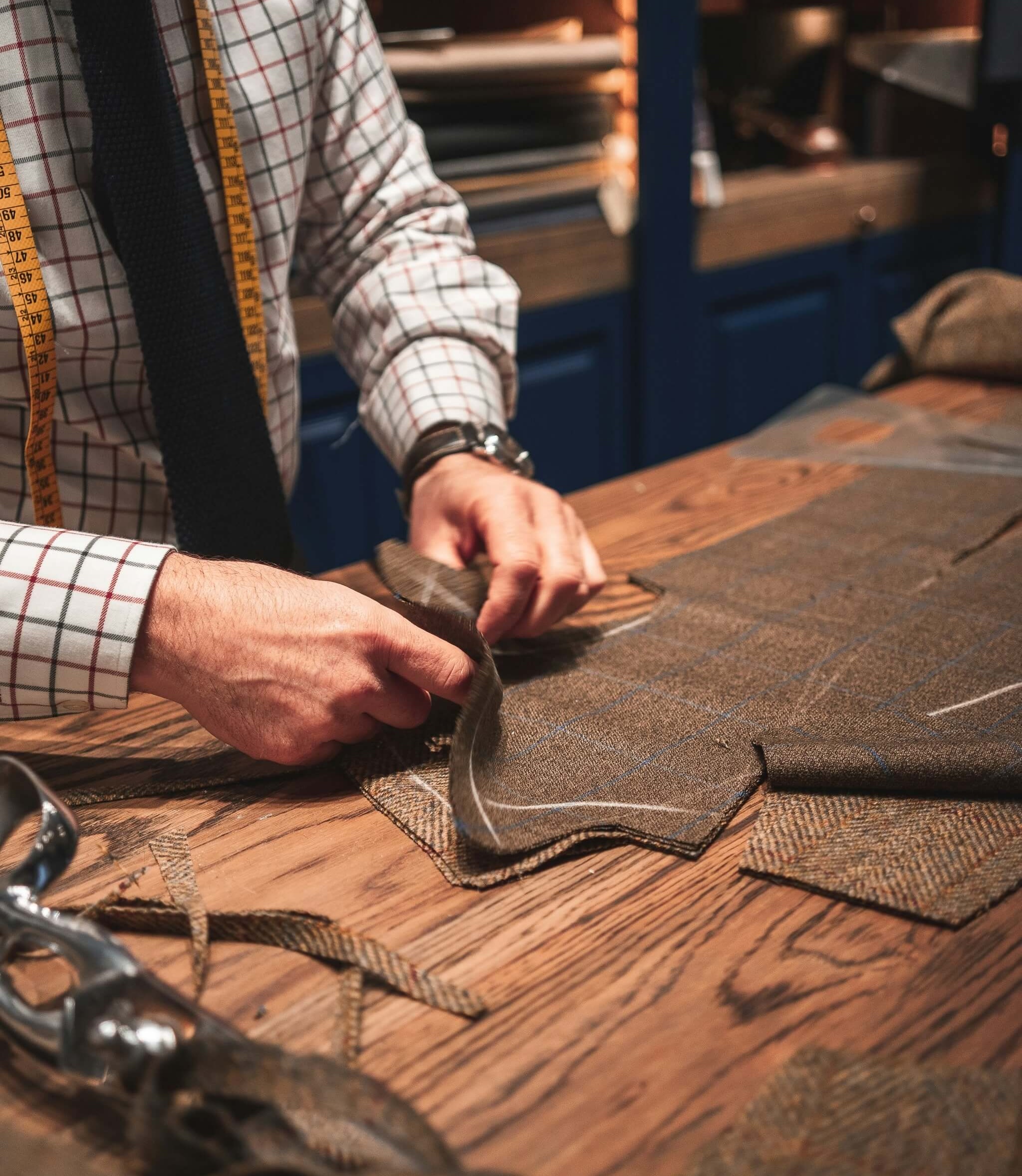 tailor cutting fabric