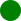 Small bright green circular dot on a white background.