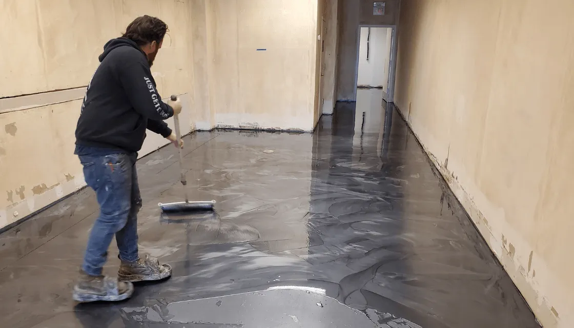 Majestic installer applying a floor coating