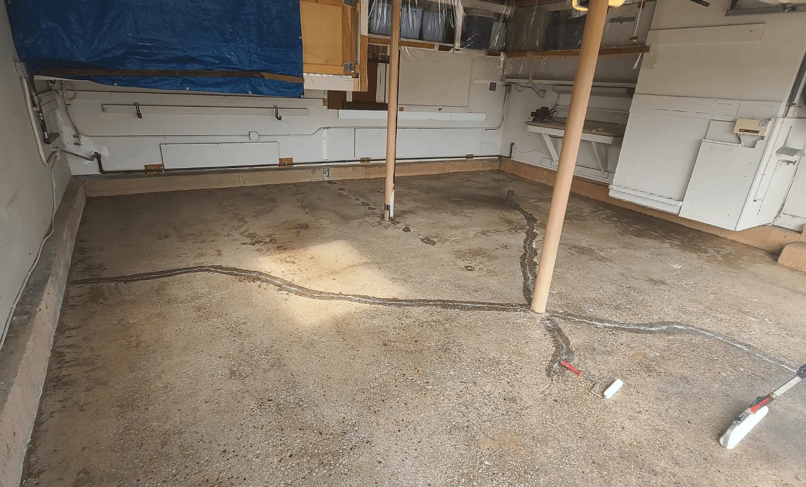 Cracked, chipped garage concrete before coating