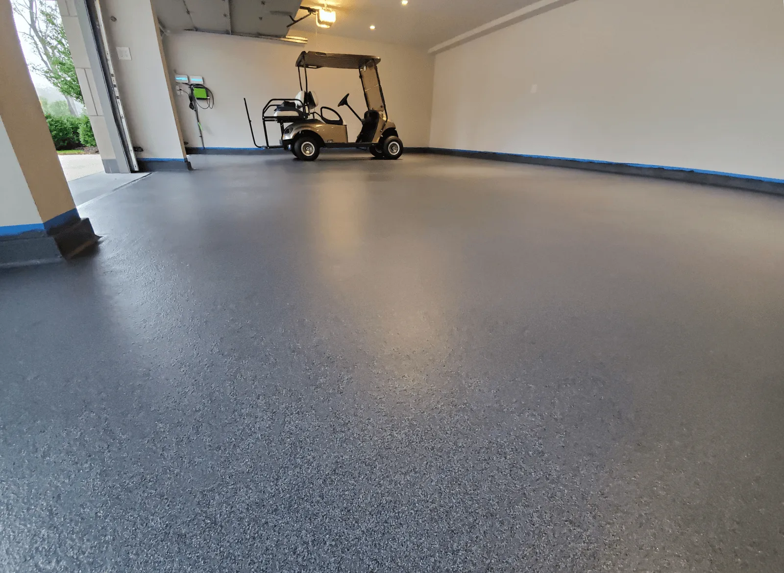 Grey flake garage floor with golf cart