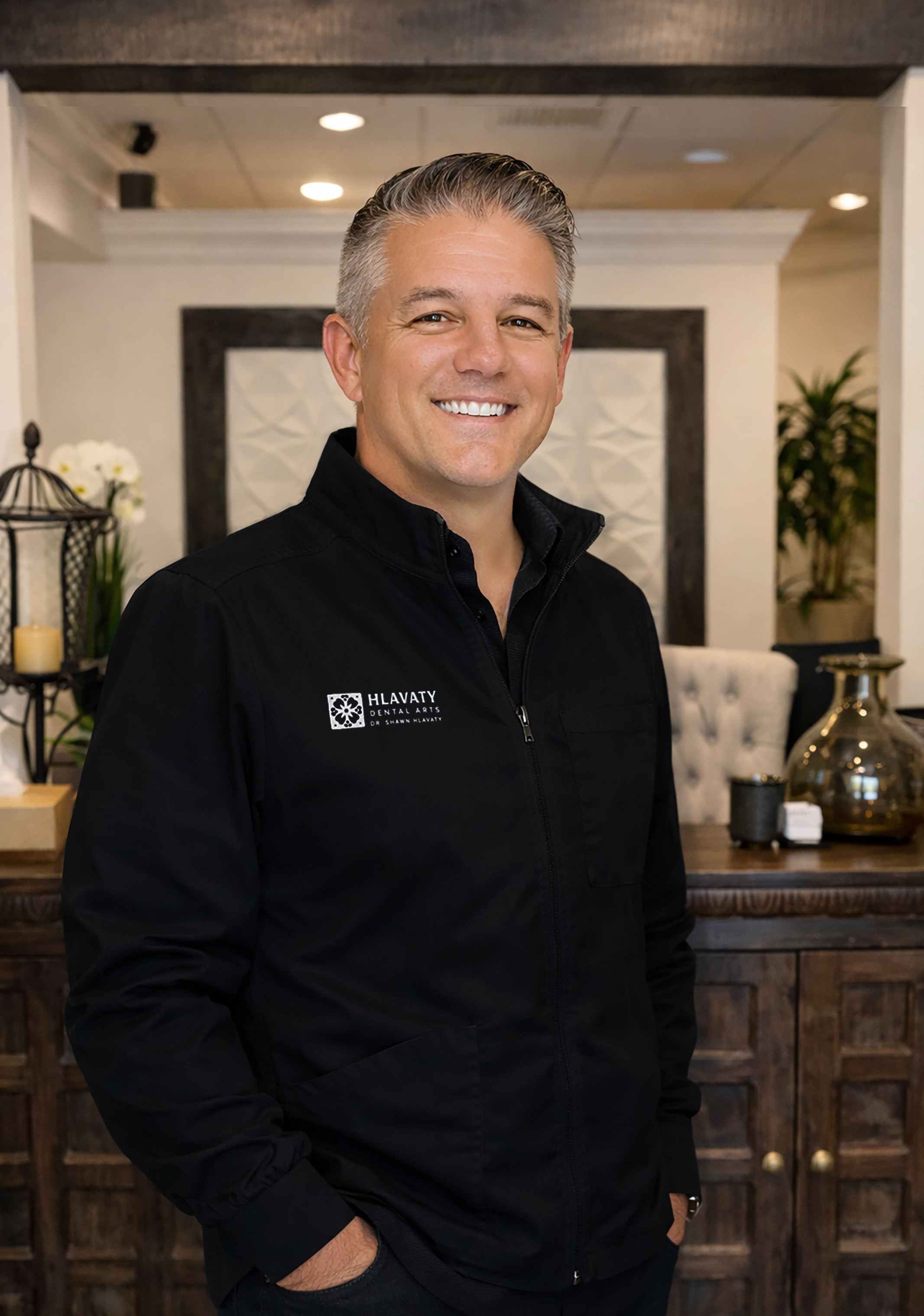 Picture of Dr. Hlavaty standing at the front desk
