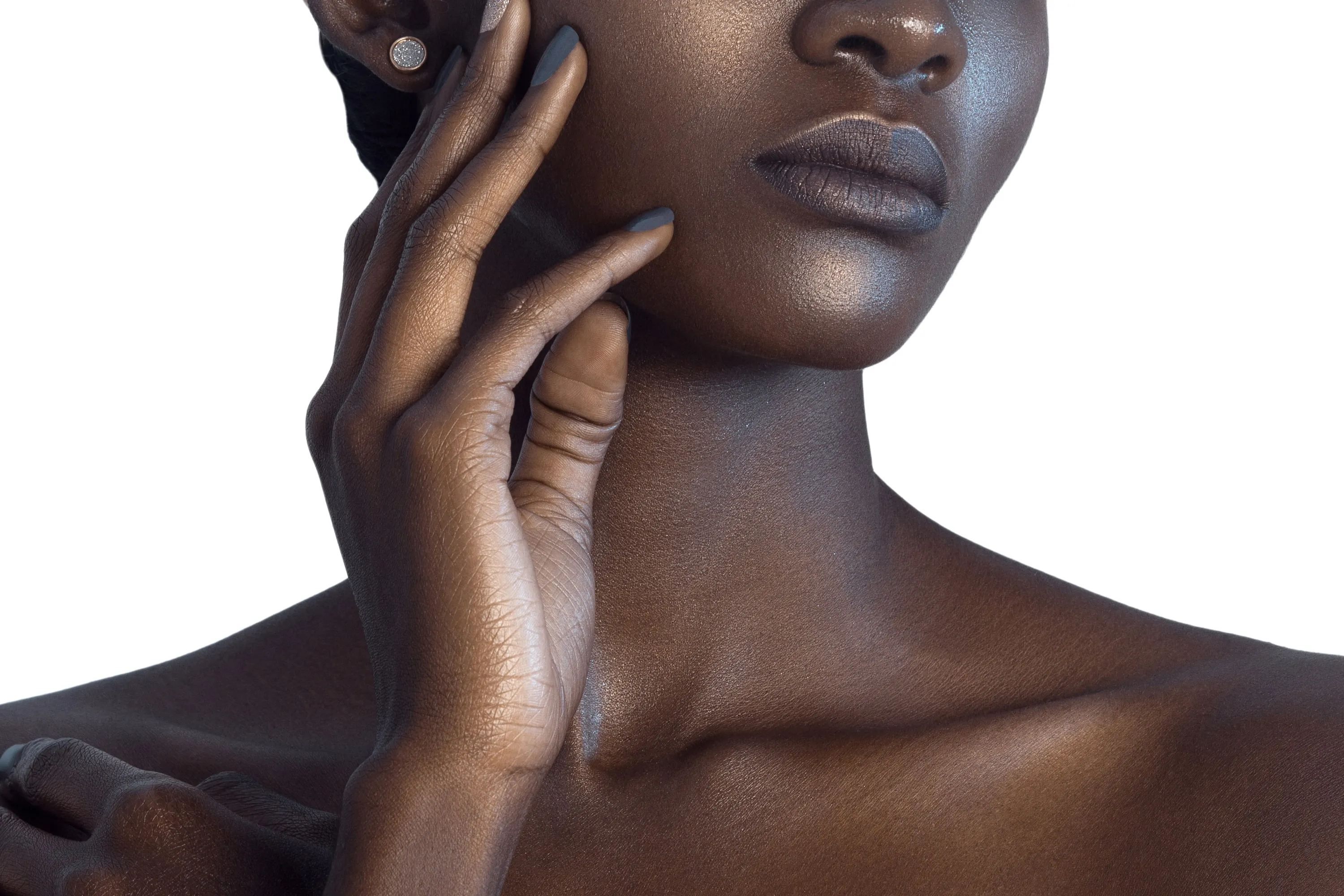 black woman holding her face