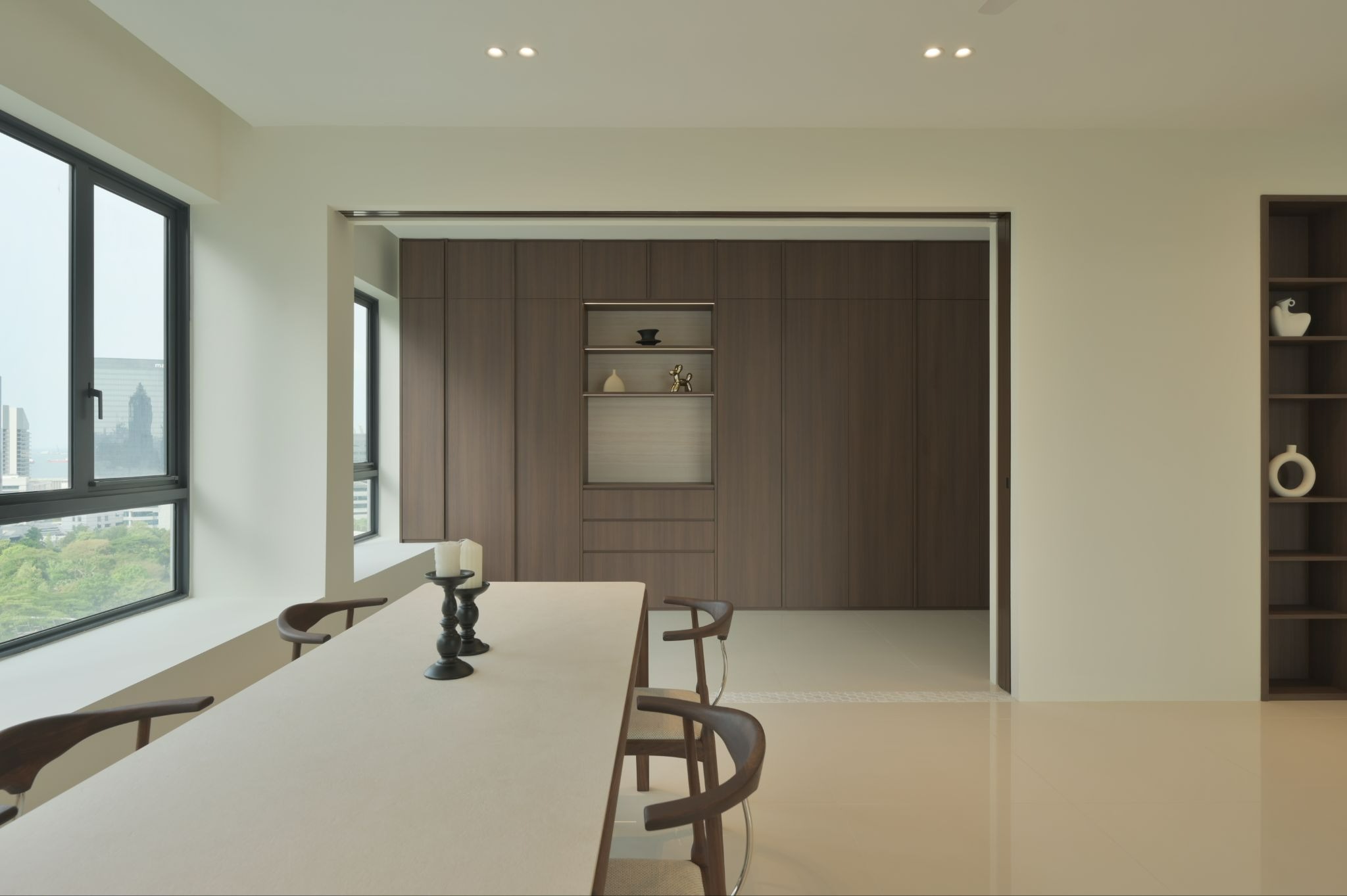 Modern HDB interior with a dining area and built-in cabinetry, illustrating renovation planning in Singapore.