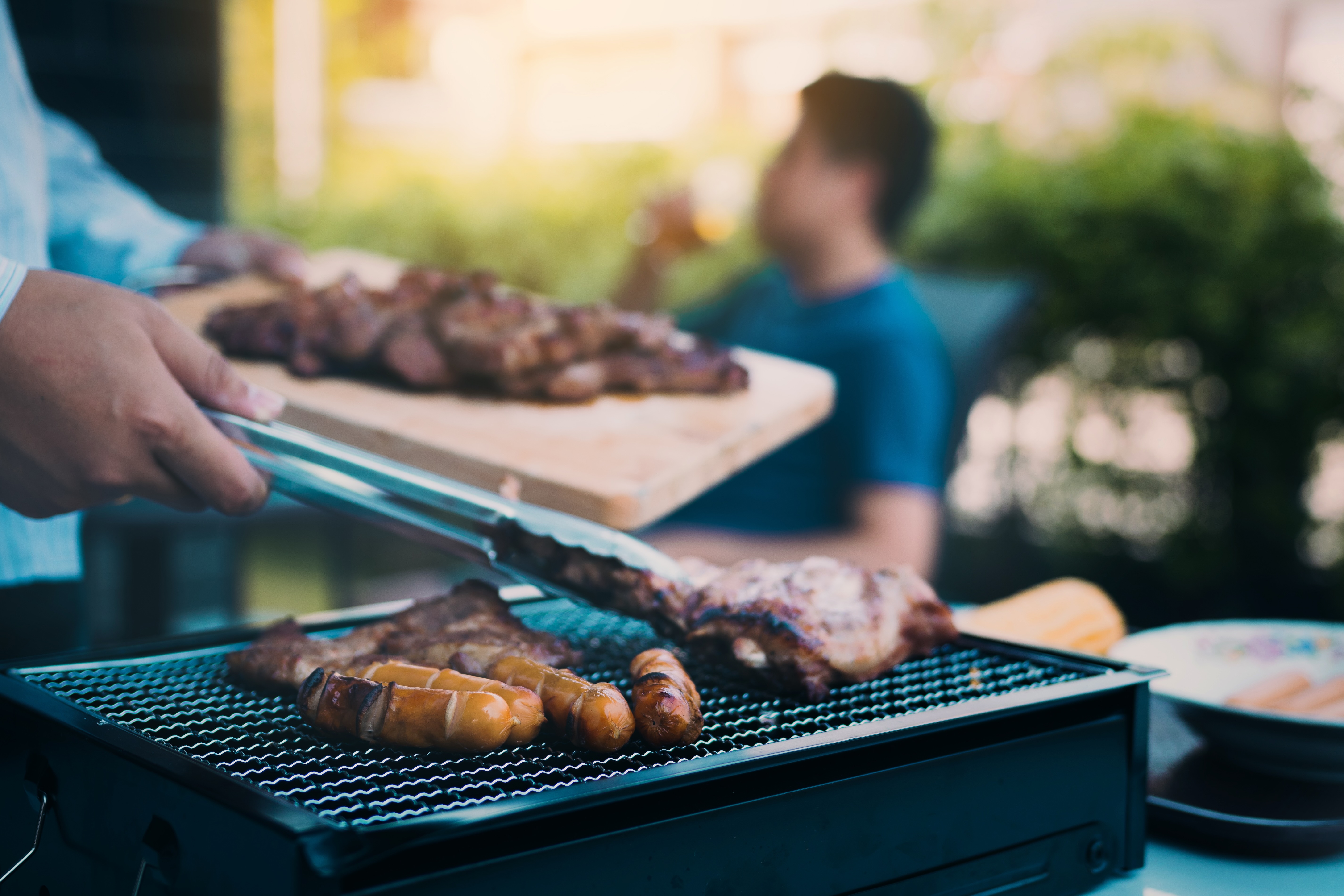Man grilling food stock photo