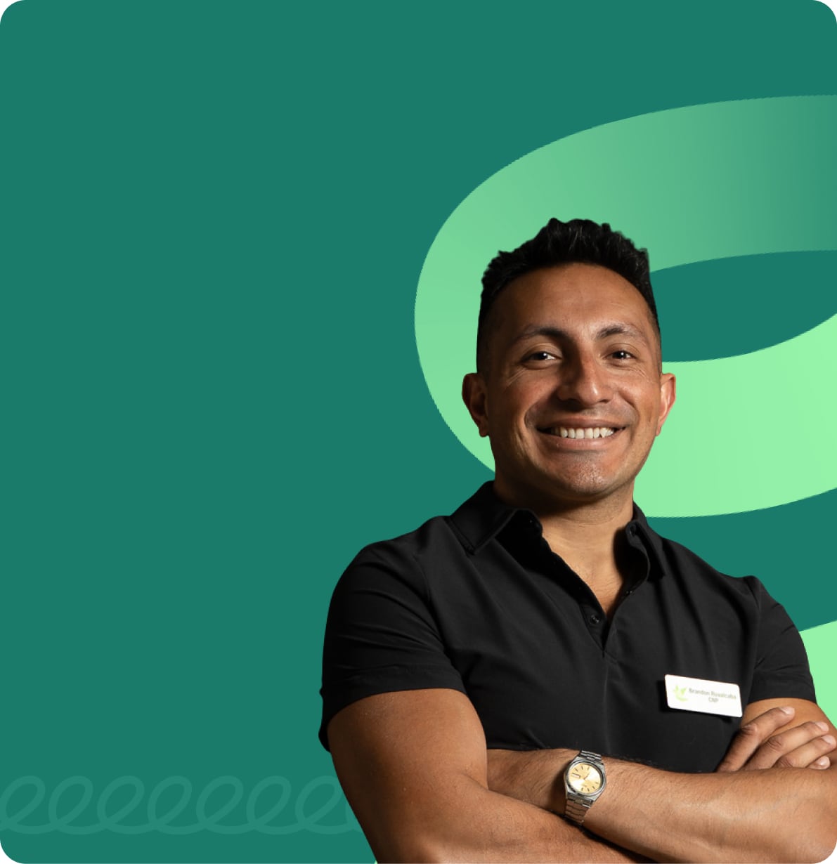 Staff headshot of Brandon Ruvalcaba, CNP, smiling with arms crossed, wearing a black polo with a name badge, in front of a green Emerald Psychiatry logomark background