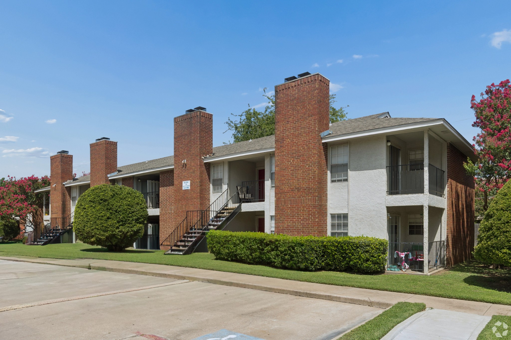 Building Exterior at Crestbrook Apartments in Burleson, Texas