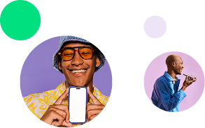 Man in yellow shirt and hat showing a blank phone screen; another man in blue shirt speaking into phone.