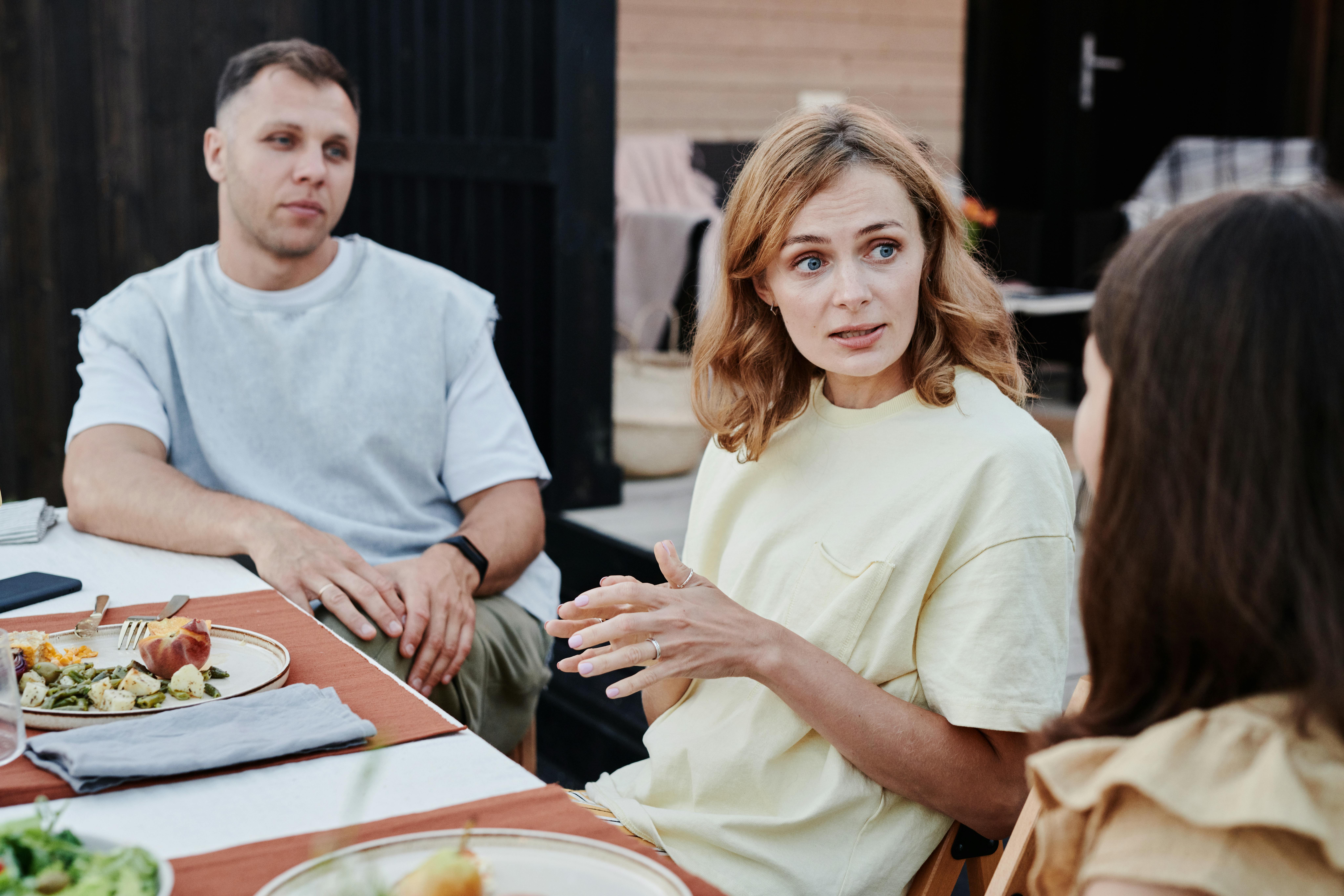 Parents having a conversation with their daughter
