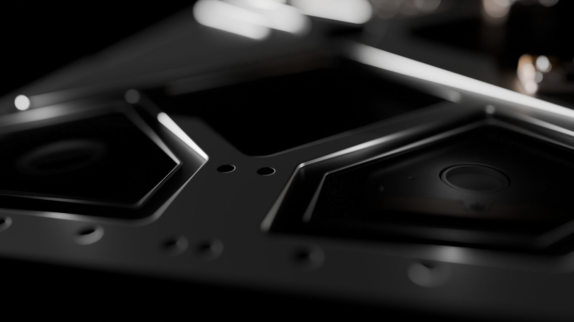 Close-up of a dark metallic surface with geometric hexagon-shaped indentations and small holes.