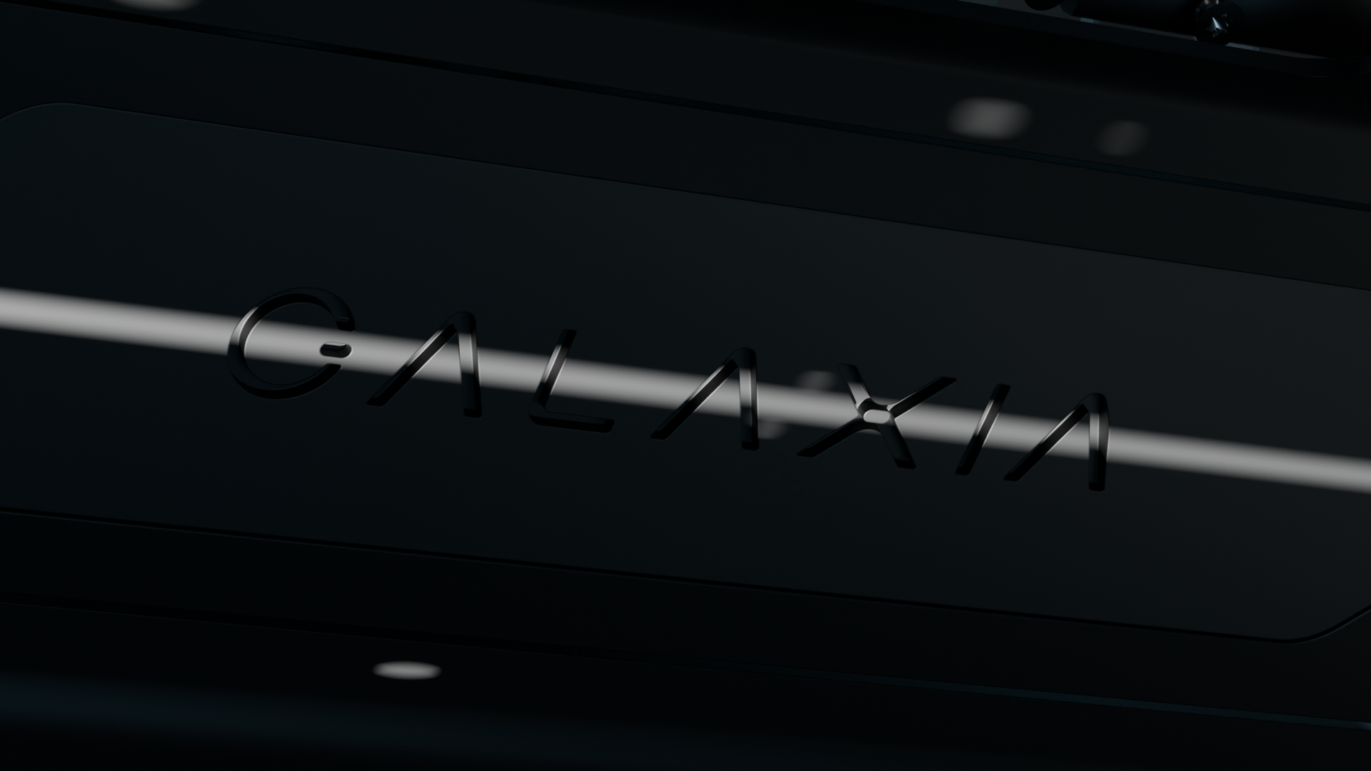 Black surface with the raised letters spelling GALAXIA in a sleek modern font.